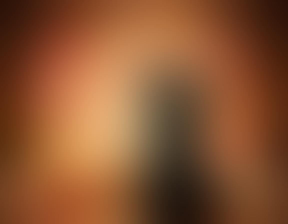 A warm, intimate scene featuring two silhouettes in a playful, flirtatious pose surrounded by soft candlelight. Gentle petals scattered around enhance the sensual atmosphere, with hints of soft colors like pink and gold creating an inviting ambiance. Emphasize the connection between the figures with subtle gestures of touch and longing glances. dreamlike, romantic lighting. soft-focus effect. vibrant colors.